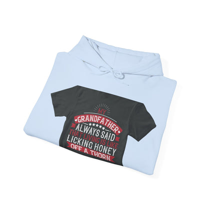 My grandfather always said that living is like licking honey off a thorn-02 — Unisex Heavy Blend Hoodie (G18500)